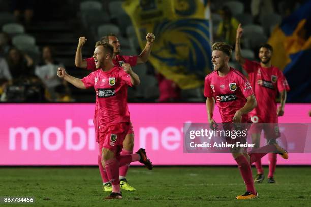Connor Pain of the Mariners celebrates a goal with his team mates during the round four A-League match between the Central Coast Mariners and the...