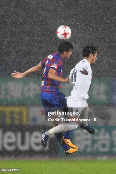 Naoyuki Fujita of Vissel Kobe and Hiroto Hatao of Ventforet Kofu compete for the ball during the J.League J1 match between Ventforet Kofu and Vissel...