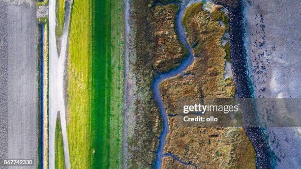 dyke, salt marsh and coastline - aerial view - netherlands aerial stock pictures, royalty-free photos & images