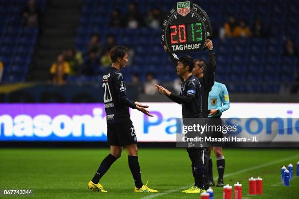 Shun Nagasawa of Gamba Osaka is replaced by Hiroto Goya during the J.League J1 match between Gamba Osaka and Vegalta Sendai at Suita City Football...