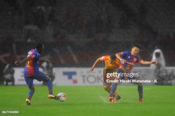 Mitchell Duke of Shimizu S-Pulse is challenged by Kensuke Nagai of FC Tokyo during the J.League J1 match between FC Tokyo and Shimizu S-Pulse at...