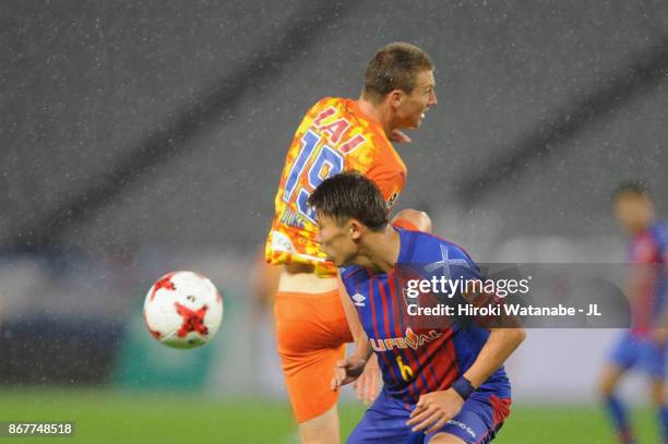 Mitchell Duke of Shimizu S-Pulse and Kosuke Ota of FC Tokyo compete for the ball during the J.League J1 match between FC Tokyo and Shimizu S-Pulse at...