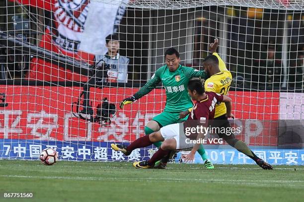 Muriqui of Guangzhou Evergrande and Yang Cheng of Hebei China Fortune compete for the ball during the Chinese Super League match between Hebei China...