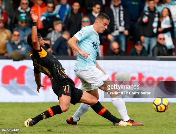 Lazio's Montenegro defender Adam Marusic fights for the ball with Benevento's Moroccan defender Achraf Lazaar during the Italian Serie a football...