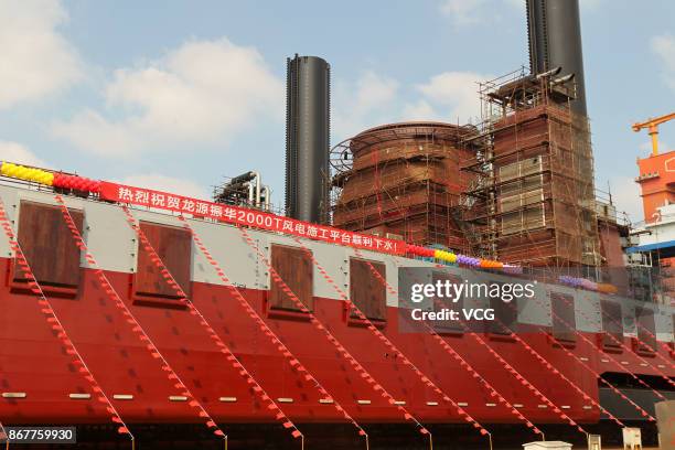 The world's largest offshore wind power operation platform, Long Yuan Zhen Hua San Hao, takes water on August 28, 2017 in Nantong, Jiangsu Province...