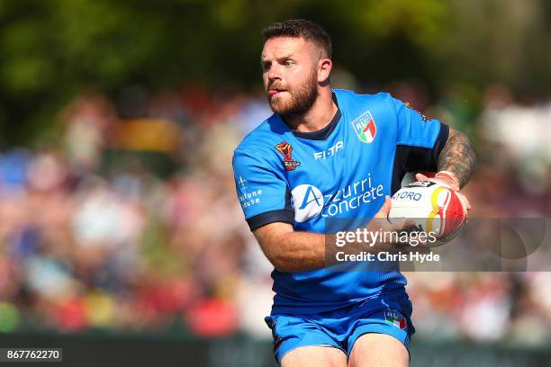 Nathan Brown of Italy passes during the 2017 Rugby League World Cup match between Ireland and Italy at Barlow Park on October 29, 2017 in Cairns,...