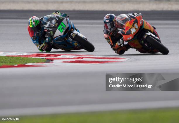 Brad Binder of South Africa and Red Bull KTM Ajo leads Franco Morbidelli of Italy and EG 00 Marc VDS during the Moto2 race during the MotoGP Of...
