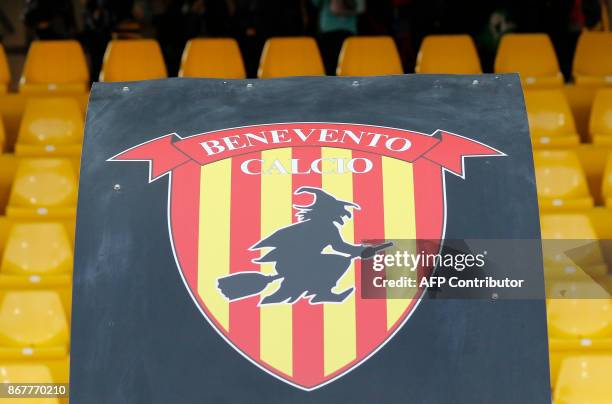 Picture of the logo of Benevento's Italian football club showing a witch riding a broom during the Italian Serie a football match Benevento Calcio vs...
