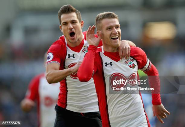 Steven Davis of Southampton celebrates as he scores their first goal with Cedric Soares of Southampton during the Premier League match between...