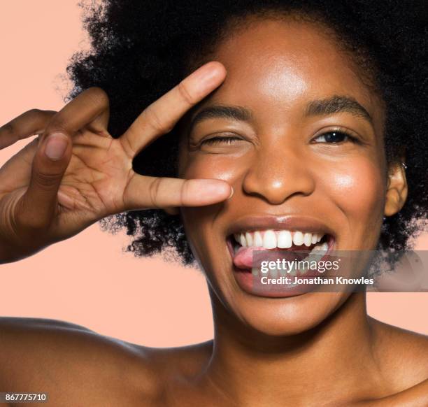 close-up of young female face - langue bouche photos et images de collection
