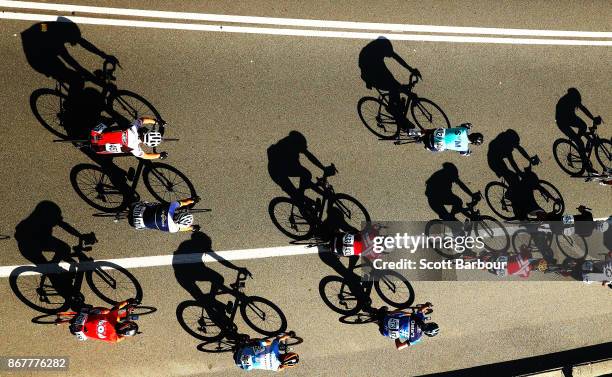 Shadows are cast by cyclists during the Cycling Road Race Test Event along Currumbin Bay on October 29, 2017 in the Gold Coast, Australia. The Road...