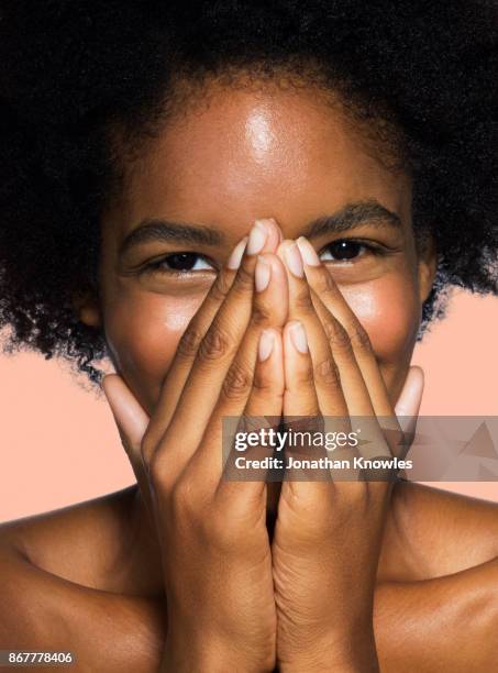 young female covering face - shy stock pictures, royalty-free photos & images