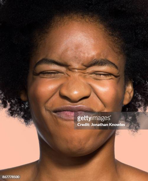 young female grinning with eyes closed - squeezing stock pictures, royalty-free photos & images