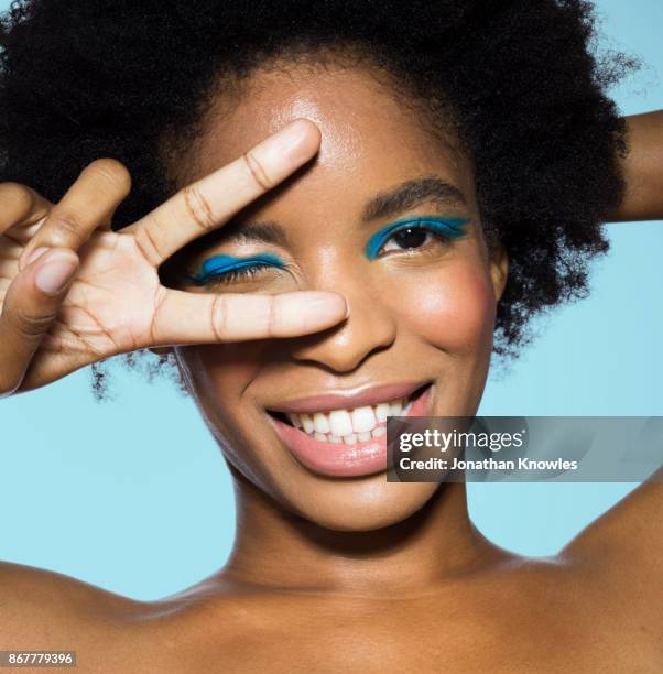 young female wearing blue eye make-up - eyeliner stock pictures, royalty-free photos & images