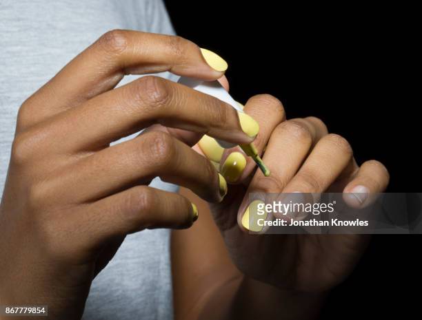 close-up of application of nail varnih - manicure fotografías e imágenes de stock