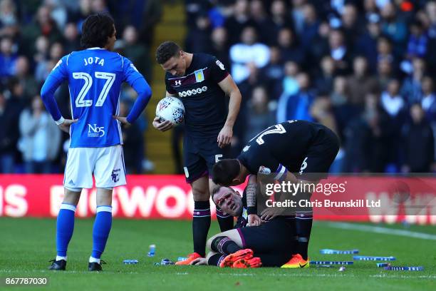 John Terry of Aston Villa checks on team-mate Glenn Whelan during the Sky Bet Championship match between Birmingham City and Aston Villa at St...