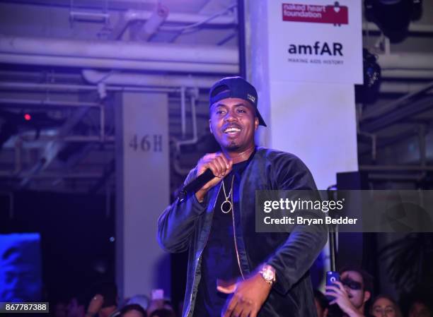 Nas performs on stage during Moet Hennessy at The 2017 amfAR and The Naked Heart Foundation Fabulous Fund Fair on October 28, 2017 in New York City.