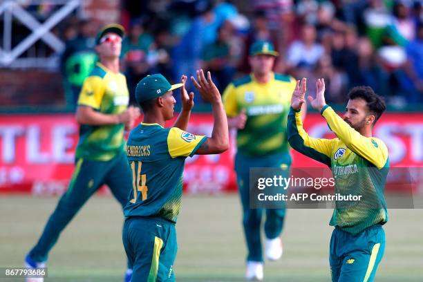 South African bowler JP Duminy celebrates the dismissal of Bangladesh batsman Sabbir Rahman during the second T20 cricket match between South Africa...