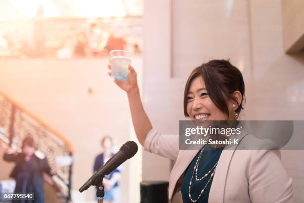 young executive business woman toasting in social party - honour board stock pictures, royalty-free photos & images