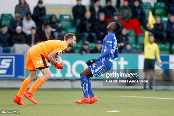 Johan Wiland, goalkeeper of Hammarby IF and Peter Wilson of GIF Sundsvall during the Allsvenskan match between GIF Sundsvall and Hammarby IF at...