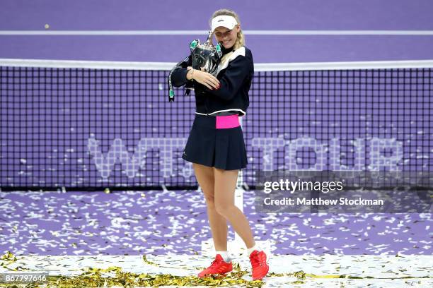 Caroline Wozniacki of Denmark celebrates victory with the Billie Jean King trophy in the Singles Final against Venus Williams of the United States...