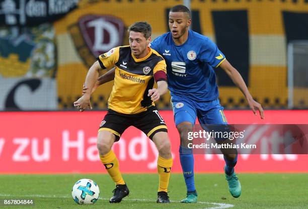 Andreas Lambertz of Dresden battles for the ball with Louis Samson of Braunschweig during the Second Bundesliga match between SG Dynamo Dresden and...