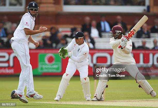 Denesh Ramdin of West Indies hits out watched by Matt Prior of England as Alastair Cook takes evasive action during day three of the 1st npower Test...