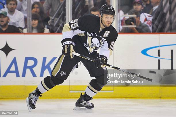 Defenseman Sergei Gonchar of the Pittsburgh Penguins passes the puck against the Washington Capitals during Game Three of the Eastern Conference...