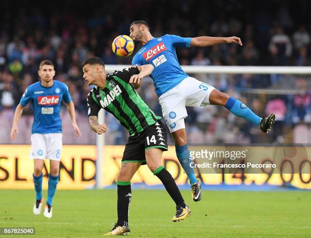 Player of SSC Napoli Faouzi Ghoulam vies with US Sassuolo player Gianluca Scamacca during the Serie A match between SSC Napoli and US Sassuolo at...