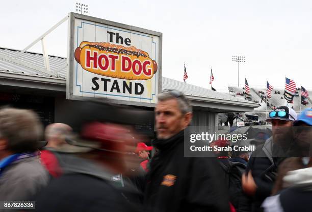 Fans stand in line at a hot dog stand during qualifying for the Monster Energy NASCAR Cup Series First Data 500 at Martinsville Speedway on October...