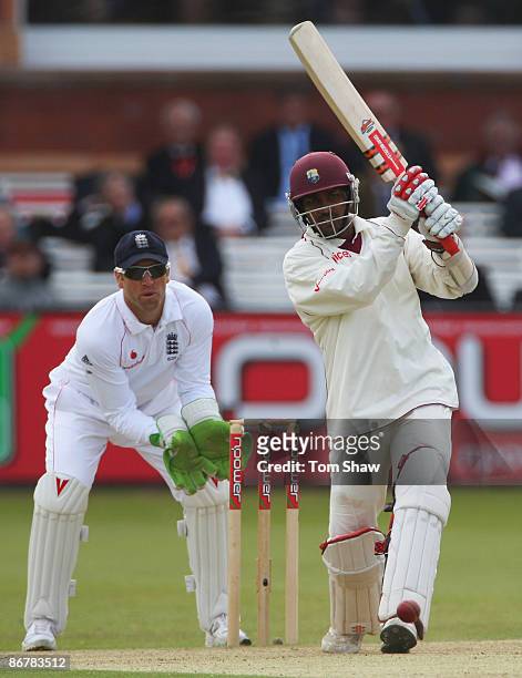 Denesh Ramdin of West Indies hits out watched by Matt Prior of England during day three of the 1st npower Test match between England and West Indies...