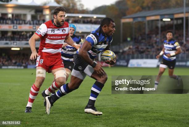 Semesa Rokoduguni of Bath breaks through to score a late try during the Aviva Premiership match between Bath Rugby and Gloucester Rugby at the...