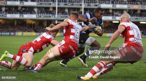 Semesa Rokoduguni of Bath breaks through to score a late try during the Aviva Premiership match between Bath Rugby and Gloucester Rugby at the...