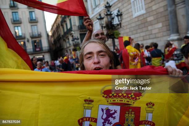 Nationalist supporters gather outside the Catalan Government building, the Palau de la Generalitat following a pro-unity protest on October 29, 2017...