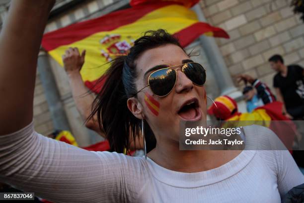 Nationalist supporters gather outside the Catalan Government building, the Palau de la Generalitat following a pro-unity protest on October 29, 2017...