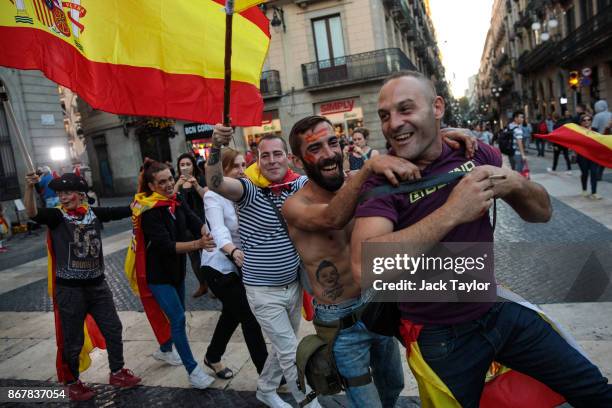 Nationalist supporters gather outside the Catalan Government building, the Palau de la Generalitat following a pro-unity protest on October 29, 2017...