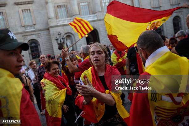 Nationalist supporters gather outside the Catalan Government building, the Palau de la Generalitat following a pro-unity protest on October 29, 2017...