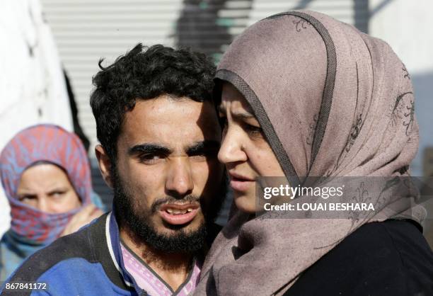 Syrian man from the recently retaken desert town of Al-Qaryatain is greeted by relatives on October 29 after the Syrian army reportedly freed him...