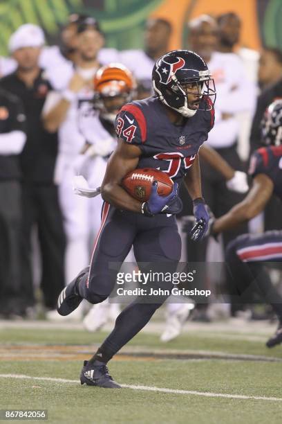 Tyler Ervin of the Houston Texans runs the ball upfield during the game against the Cincinnati Bengals at Paul Brown Stadium on September 14, 2017 in...