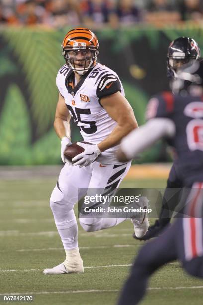 Tyler Eifert of the Cincinnati Bengals runs the ball upfield during the game against the Houston Texans at Paul Brown Stadium on September 14, 2017...