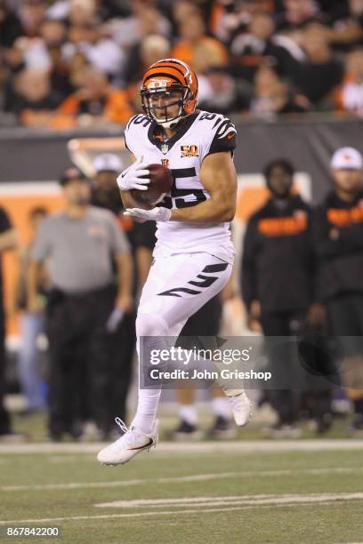 Tyler Eifert of the Cincinnati Bengals hauls in the pass during the game against the Houston Texans at Paul Brown Stadium on September 14, 2017 in...