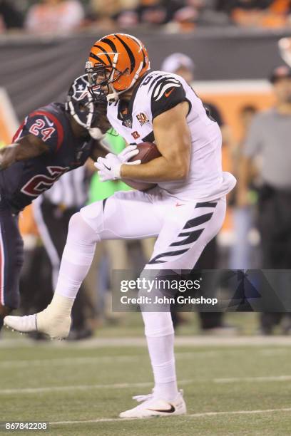 Tyler Eifert of the Cincinnati Bengals hauls in the pass during the game against the Houston Texans at Paul Brown Stadium on September 14, 2017 in...