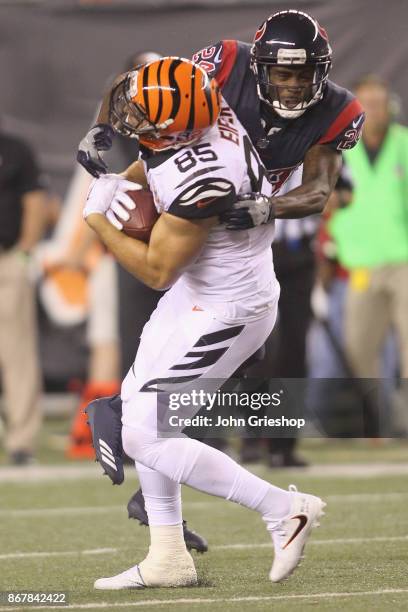 Tyler Eifert of the Cincinnati Bengals runs the football upfield against Johnathan Joseph of the Houston Texans during their game at Paul Brown...