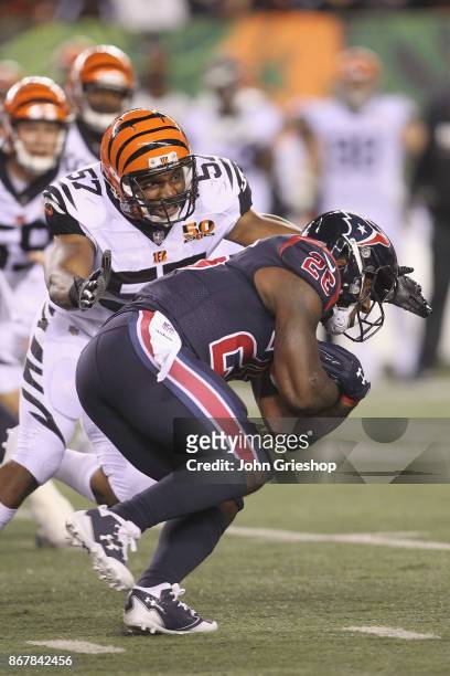 Vincent Rey of the Cincinnati Bengals makes the tackle on Jordan Todman of the Houston Texans during their game at Paul Brown Stadium on September...