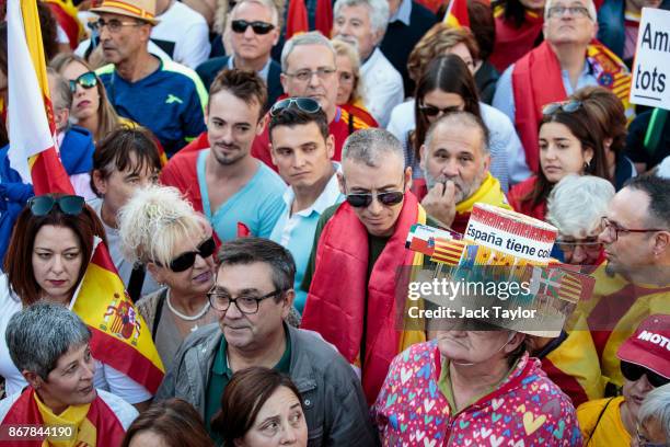 Protester wears a hat with flags of all the Spanish autonomous communities during a pro-unity demonstration on October 29, 2017 in Barcelona, Spain....