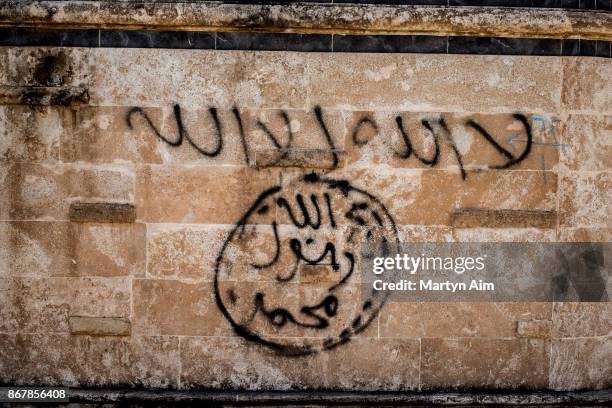 Graffiti on a church wall in Karamles, a Christian town in northern Iraq, on September 8, 2017.