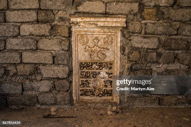 Chipped and damaged relief on the wall of a church burned by Islamic State militants in Karamles, a Christian town in northern Iraq, on September 8,...