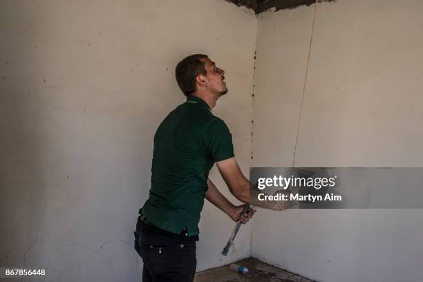 Man rings the bell in a Catholic church in Karamles, a Christian town in northern Iraq, on September 8, 2017.
