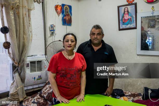 Chaldean Catholic couple in the Karemles Complex in Erbil, northern Iraq, on September 8, 2017. They have been living here for three years since...