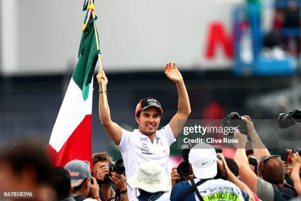 Sergio Perez of Mexico and Force India waves to the crowd on the drivers parade before the Formula One Grand Prix of Mexico at Autodromo Hermanos...